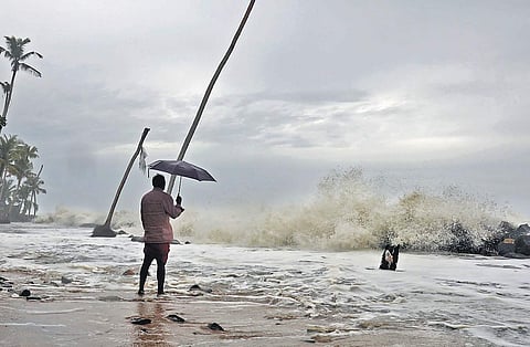 A  resident watching the rough sea at Chellanam in Kochi | ARUN ANGELA