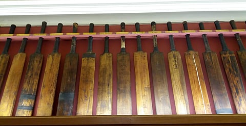 Each bat has their owner’s name written on small metal plate stuck over them. | EPS