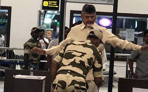 A security personnel frisked TDP president Chandrababu Naidu in Gannavaram airport. (Photo | IamNaveenKapoor/Twitter)