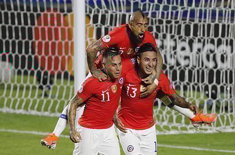 Chile's Erick Pulgar, bottom right, celebrates scoring his side's opening goal with teammates Eduardo Vargas, bottom left, and Arturo Vidal, top, during a Copa America Group C soccer match at Morumbi stadium in Sao Paulo, Brazil. (Photo | AP)