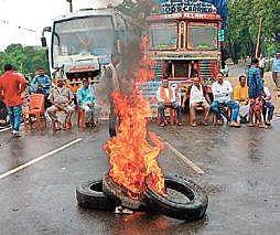 Road blocade staged by agitated farmers in Odisha over non-payment of crop insurance for last kharif season.