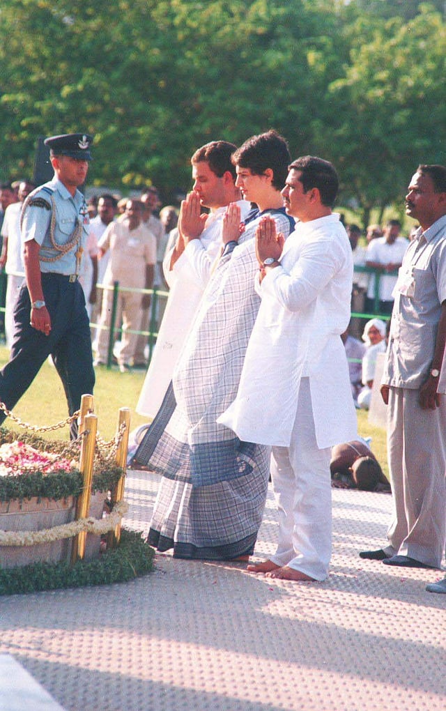 Priyanka Gandhi and Rahul Gandhi praying for their father's soul. (Express Photo)