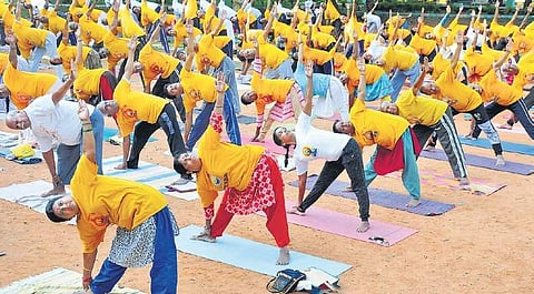 People participate in a mass yoga rehearsal camp in Mysuru on Saturday | udayshankar