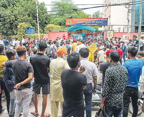 Sikhs came out in large numbers and protested the police brutality outside the Mukherjee Nagar police station on Sunday (Photo | PTI)