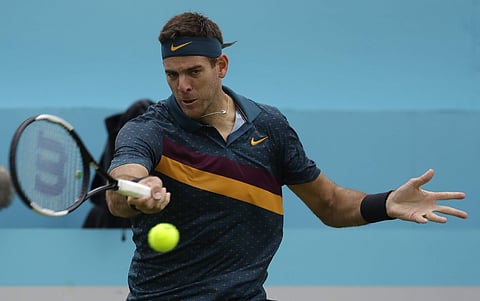Juan Martin Del Potro of Argentina plays a return to Denis Shapovalov of Canada during the Queens Club tennis tournament in London. (Photo | AP)