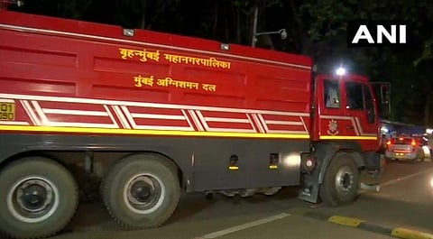 One person is suspected to be trapped inside the ship. Fire is confined on the second and the third floor of the ship. Fire fighting operations underway. | (ANI)