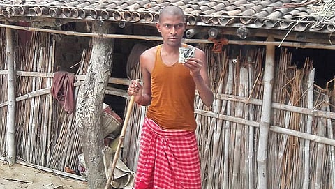 Manoj Sah shows an ORS packet distributed by health officials in his village. But now, he says, it is of no use with his daughter already gone. (Photo | Rajesh Thakur)