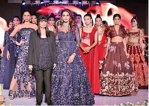 Nayanika Chatterjee (left) and Neeta Lulla (in black) at one of her fashion shows