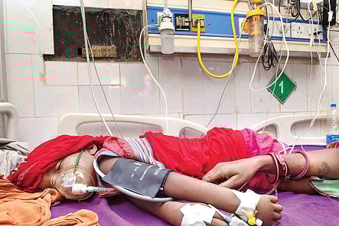 A child with symptoms of Acute Encephalitis Syndrome undergoes treatment at a hospital in Muzaffarpur. (Photo | PTI)