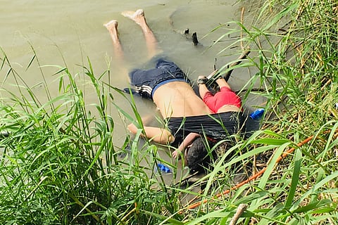 The bodies of Salvadoran migrant Oscar Alberto Mart nez Ram rez and his 2-year-old daughter Valeria lie on the bank of the Rio Grande in Matamoros, Mexico. (Photo | AP)