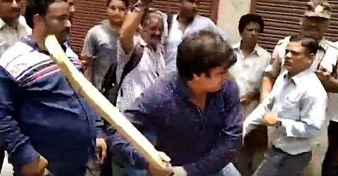 BJP MLA Akash Vijayavargiya seen thrashing civic officials with a cricket bat in Indore. (Videograb)