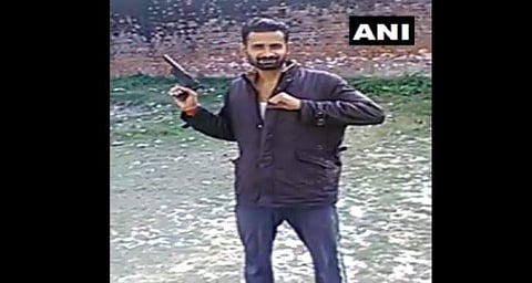 An inmate at the Unnao jail seen in a viral video brandishing a pistol. (Photo | ANI, Twitter)