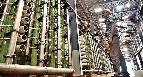 A worker at the existing desalination plant at Nemmeli | P Jawahar