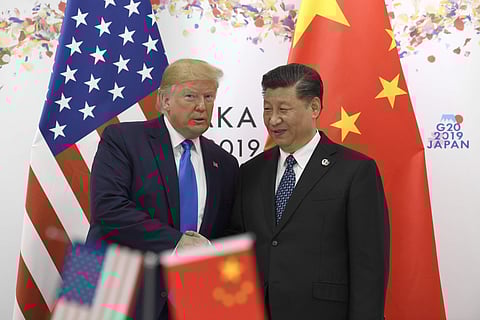 President Donald Trump poses for a photo with Chinese President Xi Jinping during a meeting on the sidelines of the G-20 summit in Osaka, Japan, Saturday, June 29, 2019. | AP