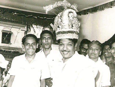 M Karunanidhi with floral head gear offered by partymen at a meeting. (File Photo | EPS)