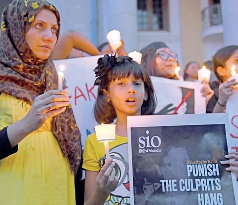 People hold candlelight vigil, seeking justice for the minor Kathua rape victim.| Express File Photo