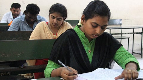 Candidates are seen writing the UPSC Examination in an exam centre at Madurai. 