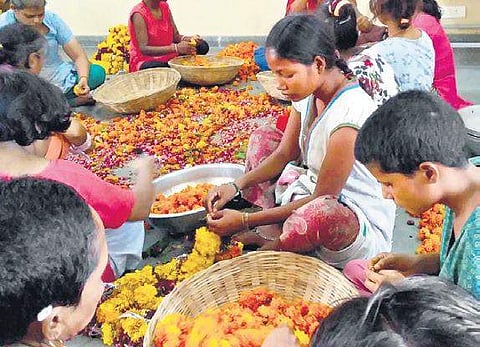 It is estimated that an eye-popping 800 million tonnes of flowers, including roses and yellow marigolds, are offered by millions of devotees across the temples, mosques and gurudwaras across the country.  (Photo | EPS)