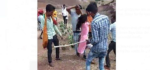 Screengrab of the video in which the kin of the girl are seen thrashing her.