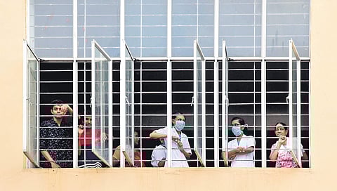 Patients and nurses look at the isolation ward set up at the Ernakulam Medical College on Monday | Albin Mathew
