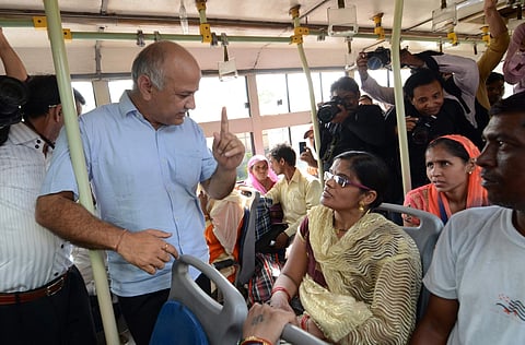 Delhi Deputy Chief Minister Manish Sisodia interacts with a woman passenger in a DTC bus in New Delhi on June 4, 2019. (Photo | Naveen Kumar, EPS)