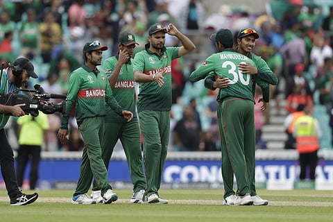 Bangladesh's captain Mashrafe Mortaza, centre, celebrates with his teammates.| AP
