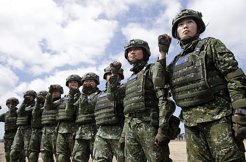 The first team of Taiwan artillerywomen poses for the press during the annual Han Kuang exercises in Pingtung County in Southern Taiwan (File photo | AP)