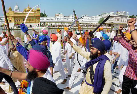 Members of various radical Sikh organizations shout pro-Khalistan slogans at an event organised to mark the 35th anniversary of the Operation Blue Star 1984 at Golden Temple. (Photo| PTI)