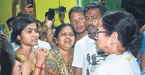 West Bengal Chief Minister and Trinamool supremo Mamata Banerjee meets the family of deceased party activist Nirmal Kundu at his residence in Nimta, North 24 Parganas district, on Thursday | PTI