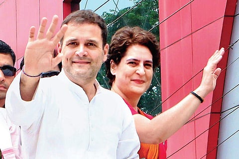 Rahul Gandhi and Priyanka Gandhi Vadra greet party workers on their way to the Wayanad district collectorate at Kalpetta on Thursday. (File | EPS/T P Sooraj)