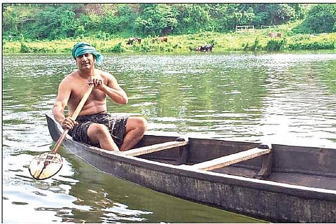 Shaju Varghese of Meloor paddling away in his newly-purchased  boat | Express