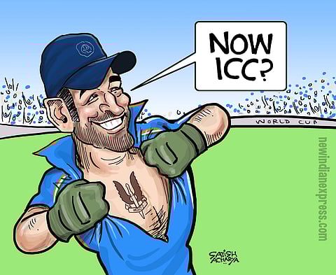 ICC has denied MS Dhoni permission to wear green wicket-keeping gloves. Our cartoonist Satish Acharya suggests a way for the former captain to get the logo in, even with the 'balidan' in place.