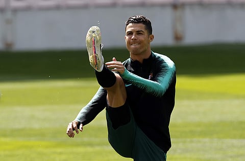 Portugal's Cristiano Ronaldo exercises during a training session at the Bessa stadium in Porto (Photo | AP)