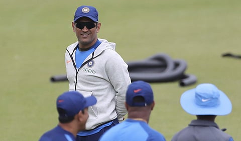 India's MS Dhoni interacts with team's support staff before batting in the nets during a training session ahead of their Cricket World Cup match against Australia at The Oval in London, Saturday, June 8, 2019. | AP