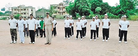 Surrendered Maoists and transgenders undergoing training at District Police Office parade ground in Malkangiri. (Photo | EPS)