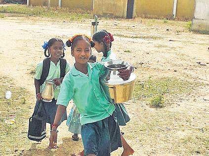 Since schools reopened on June 3, the children have had  to fetch water for their families and classes, often despite the scorching heat.