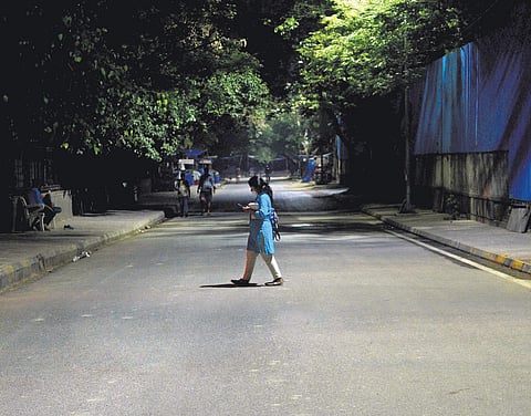 A poorly-illuminated lane outside the Jawahar Lal Nehru Stadium station. (Photo | Naveen Kumar, EPS)