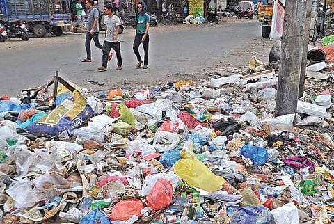 Garbage accumulated on a road at Auto Nagar in Vijayawada I Prasant Madugula