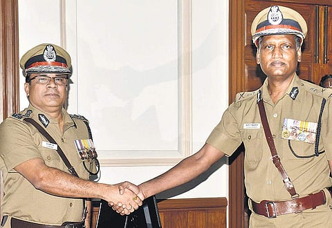 TK Rajendran welcoming the new DGP, J K Tripathy, to the headquarters. (Photo | D Sampathkumar, EPS)