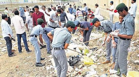 Workers cleaning the Thurpu canal