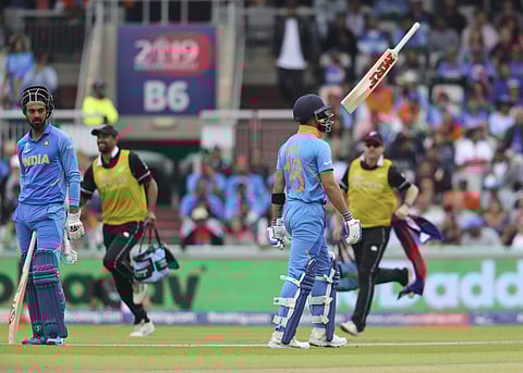 India's captain Virat Kohli throws his bat in the air after being dismissed during the Cricket World Cup semifinal match between India and New Zealand at Old Trafford in Manchester. (Photo | AP)