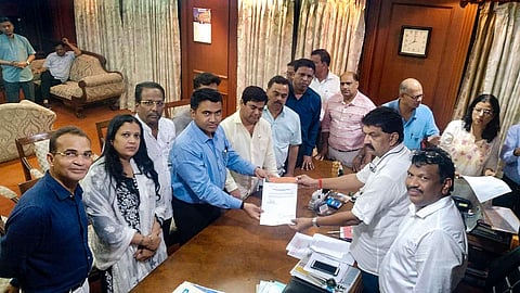 Ten of 15 Congress members led by leader of opposition Chandrakant Kavlekar gives letter for merger of their faction in BJP to Speaker Rajesh Patnekar in Panaji Wednesday. (Photo | PTI)