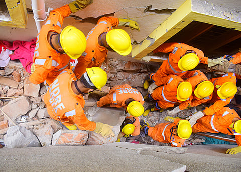 NDRF personnel  at the building collapse site in Bengaluru's Cooke Town. (Photo | Pandarinath B, EPS)