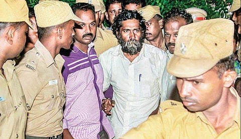 Activist Mugilan being brought to the house of judicial magistrate in Karur on early hours of Wednesday | Aravind Raj