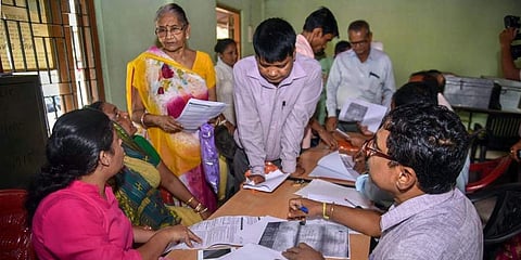 People verify the National Register of Citizens NRC forms to file claims and objections at an NRC centre in Guwahati Tuesday Spet 25 2018. | (File | PTI)