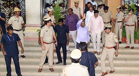 Congress MLA ST Somashekar wave to Media after meeting Speaker at Vidhana Soudha's west entrance in Bengaluru on Thursday. | (Vinod Kumar T | EPS)
