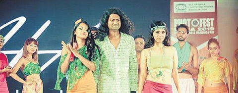 Manisha (left), designer Harold Andrade (centre) and Teena (right) walking the ramp at Zoom Fashion Week Kochi