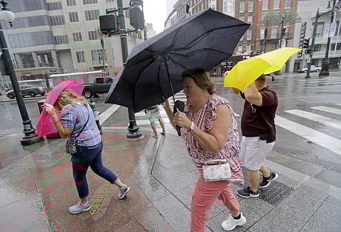 People battle the wind and rain from Hurricane Barry as it nears landfall Saturday, July 13, 2019, in New Orleans. (Photo | AP)