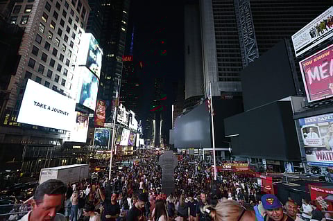 Authorities were scrambling to restore electricity to Manhattan following a power outage that knocked out Times Square's towering electronic screens and darkened marquees in the theater district and left businesses without electricity, elevators stuck and