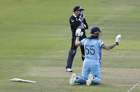 England's Ben Stokes holds up his hands apologetically after get a 6 from overthrows during the Cricket World Cup final match between England and New Zealand at Lord's cricket ground in London. (Photo | AP)